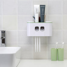 Laden Sie das Bild in den Galerie-Viewer, Wall-mounted Ecoco toothbrush holder and dual toothpaste dispenser with a sleek, minimalist design, featuring top storage space for toiletries and a neat setup for hanging toothbrushes. Ideal for organized, clutter-free bathroom spaces, adding both functionality and a modern touch to your daily routine.