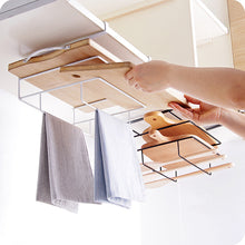 Laden Sie das Bild in den Galerie-Viewer, An under-shelf kitchen organizer rack holding wooden chopping boards and hanging cloth towels, maximizing vertical storage space in a modern kitchen setup.