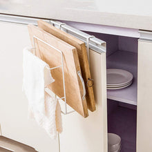 Laden Sie das Bild in den Galerie-Viewer, Side view of a kitchen cabinet door-mounted rack holding two wooden cutting boards and a white towel, showcasing a convenient storage solution that keeps items accessible and organized.