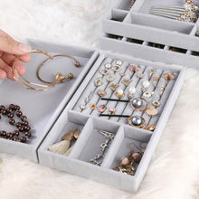 Load image into Gallery viewer, Close-up of premium gray velvet jewelry trays featuring meticulously organized compartments filled with elegant accessories. Displayed items include gold bracelets, pearl earrings, sparkling studs, intricate necklaces, and dainty charms. A luxurious and practical solution for keeping your jewelry collection sorted and easily accessible, perfect for enhancing a sophisticated dressing space.