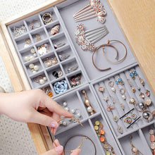 Load image into Gallery viewer, Elegant gray velvet jewelry organizer trays neatly arranged in a drawer, showcasing various jewelry pieces, including earrings, rings, bracelets, necklaces, and hair accessories. Perfect for maintaining a clutter-free and organized jewelry collection while adding a luxurious touch to home decor. These stackable trays protect delicate items from scratches and ensure easy access, making them ideal for personal use or retail displays.