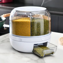 Laden Sie das Bild in den Galerie-Viewer, Rotating grain dispenser with multiple transparent compartments, holding grains such as millet and mung beans. The white base features a pull-out drawer at the bottom for easy dispensing, making it ideal for organized kitchen storage.