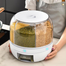 Laden Sie das Bild in den Galerie-Viewer, Person holding a MessFree® rotating grain dispenser with multiple compartments filled with grains, such as mung beans, rice, chickpeas, and millet. The dispenser's transparent design allows visibility of each compartment's contents, providing an organized and efficient kitchen storage solution.
