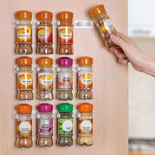 Load image into Gallery viewer, Clip-on spice organizer on a cabinet door
