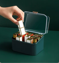 Load image into Gallery viewer, Taking a lipstick from a green organizer