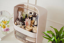 Load image into Gallery viewer, Pink makeup organizer filled with skincare