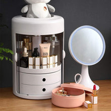 Load image into Gallery viewer, Rotating makeup organizer beside a vanity mirror