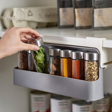 Load image into Gallery viewer, Taking a jar from the spice rack