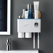 Laden Sie das Bild in den Galerie-Viewer, Blue wall-mounted toothbrush holder with 2 cups and toothpaste dispenser