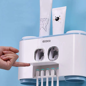 Ecoco wall-mounted toothbrush holder with dual automatic toothpaste dispensers, featuring a touch-press function for easy dispensing. Perfect for family use, this sleek organizer holds multiple toothbrushes and toothpaste tubes, enhancing bathroom hygiene and convenience. The compact design saves counter space and adds a modern touch to any bathroom decor.