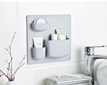 Laden Sie das Bild in den Galerie-Viewer, Wall storage grid with toiletries by a sink
