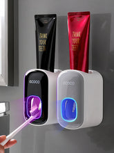 Laden Sie das Bild in den Galerie-Viewer, Using wall-mounted toothpaste dispensers
