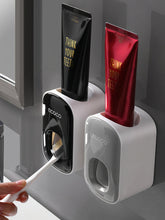 Laden Sie das Bild in den Galerie-Viewer, Two toothpaste dispensers in use
