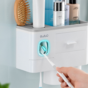 Wall-mounted bathroom organizer with a built-in toothpaste dispenser and LED toothbrush sterilizer, ensuring hygiene and convenience in one compact design. This multipurpose storage solution offers space for toiletries, brushes, and cosmetics, keeping your sink area organized and clutter-free.