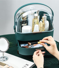 Laden Sie das Bild in den Galerie-Viewer, Taking makeup from the drawer of a green organizer
