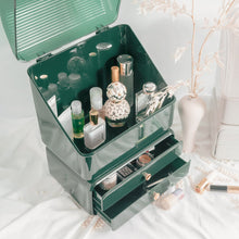 Load image into Gallery viewer, Green makeup vanity box open and filled with cosmetics
