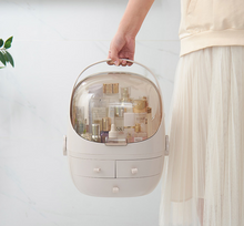 Load image into Gallery viewer, Carrying a makeup organizer by its handle
