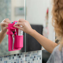 Load image into Gallery viewer, Sticking a silicone holder to a bathroom mirror
