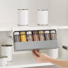 Load image into Gallery viewer, Pull-out spice rack under a kitchen shelf
