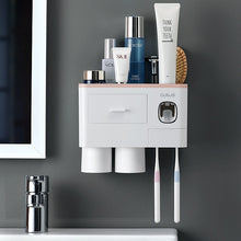 Laden Sie das Bild in den Galerie-Viewer, Pink wall-mounted toothbrush holder with 2 cups and toothpaste dispenser

