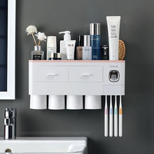 Laden Sie das Bild in den Galerie-Viewer, Pink wall-mounted toothbrush holder with 4 cups and toothpaste dispenser
